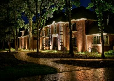 side view of house with outdoor lighting